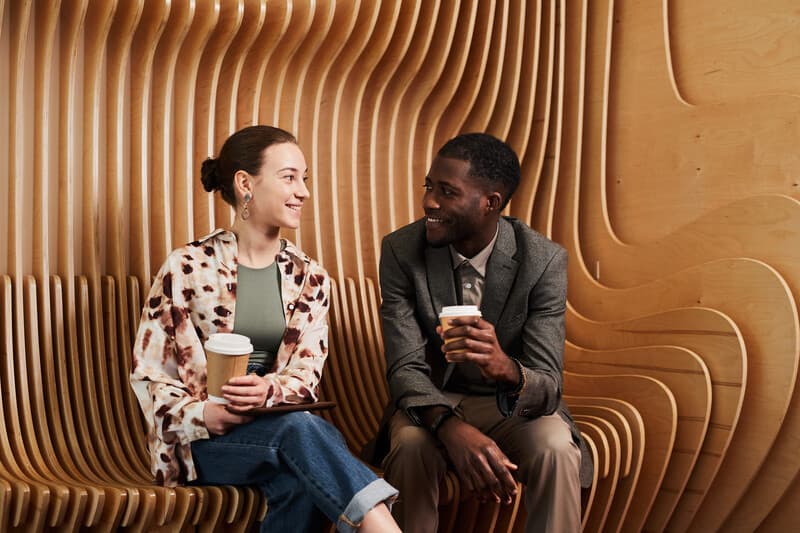 Young People Relaxing in Office Lounge